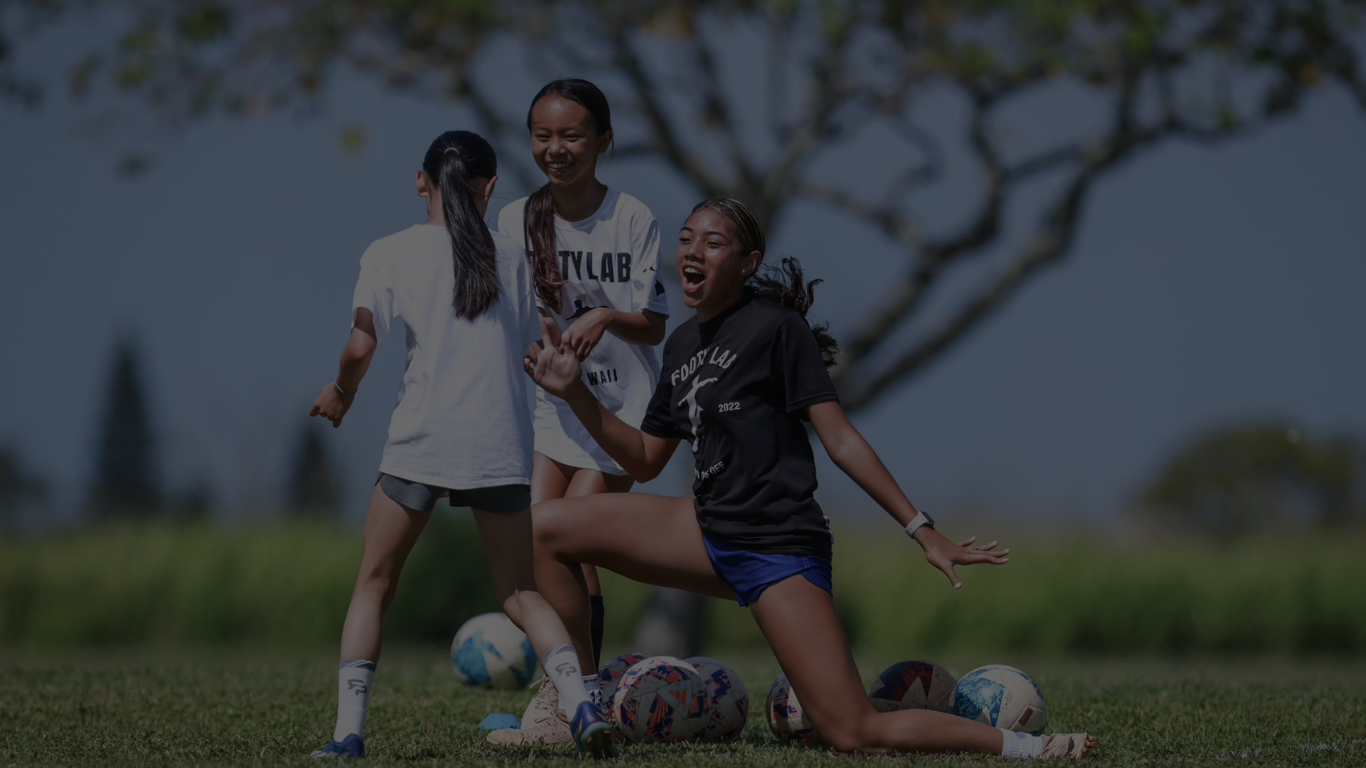 A group of young soccer players enjoying their group session.